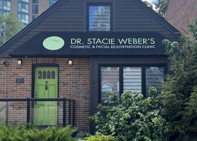 Exterior of Dr. Stacie Weber's Cosmetic & Facial Rejuvenation Clinic in Barrie, Ontario, CA with green door.