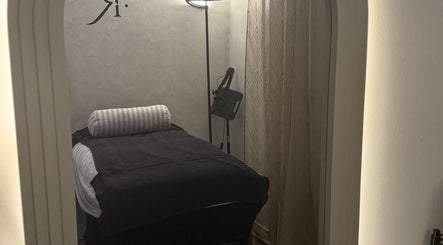 Tranquil treatment room at Body Revolution Aesthetics, Leeds, England, GB. Soft lighting enhances relaxation.