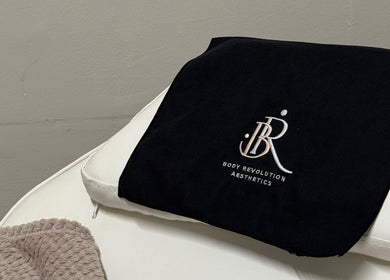 Luxurious spa towel with Body Revolution Aesthetics logo in Leeds, England, GB.