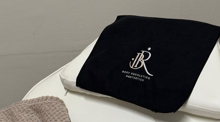 Luxurious spa towel with Body Revolution Aesthetics logo in Leeds, England, GB.