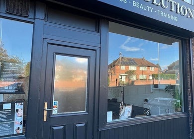Front entrance of Body Revolution Aesthetics in Leeds, England, GB showcasing modern design and creative signage.