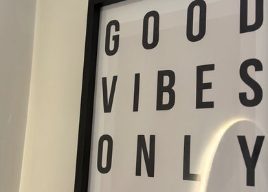 Framed 'Good Vibes Only' sign at Body Revolution Aesthetics, Leeds, England, GB.