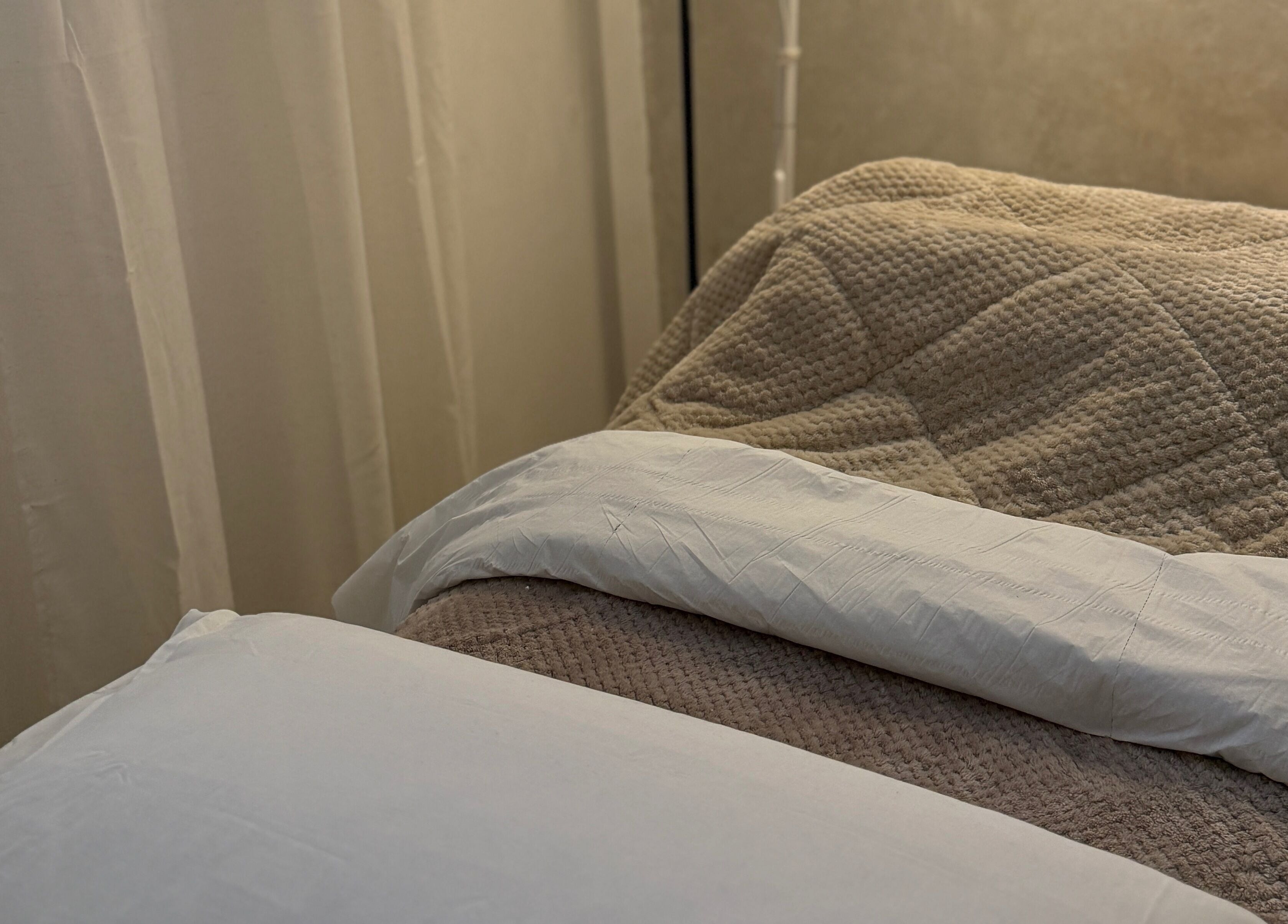 Relaxing massage bed with plush linens at Body Revolution Aesthetics, Leeds, England, GB.