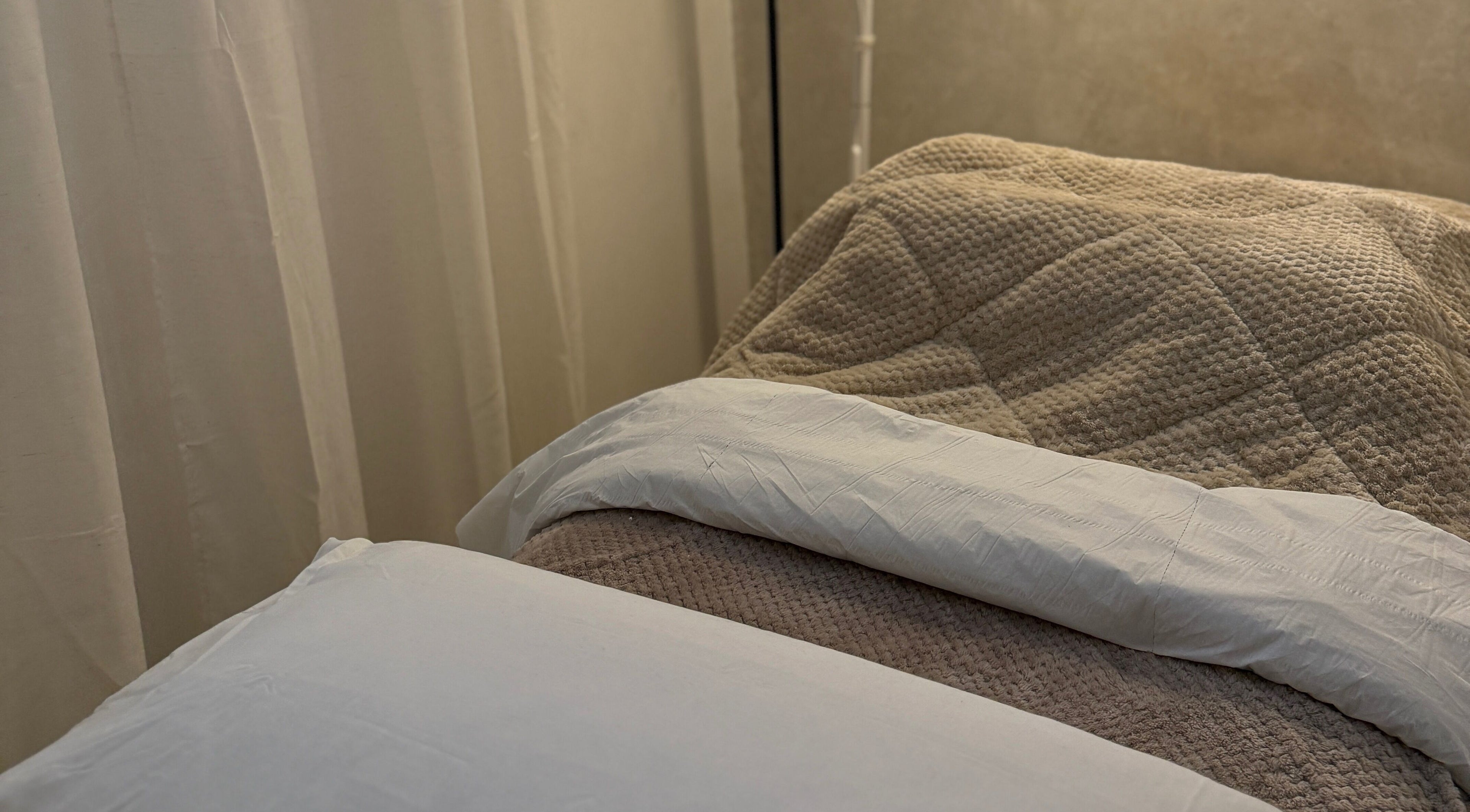 Relaxing massage bed with plush linens at Body Revolution Aesthetics, Leeds, England, GB.