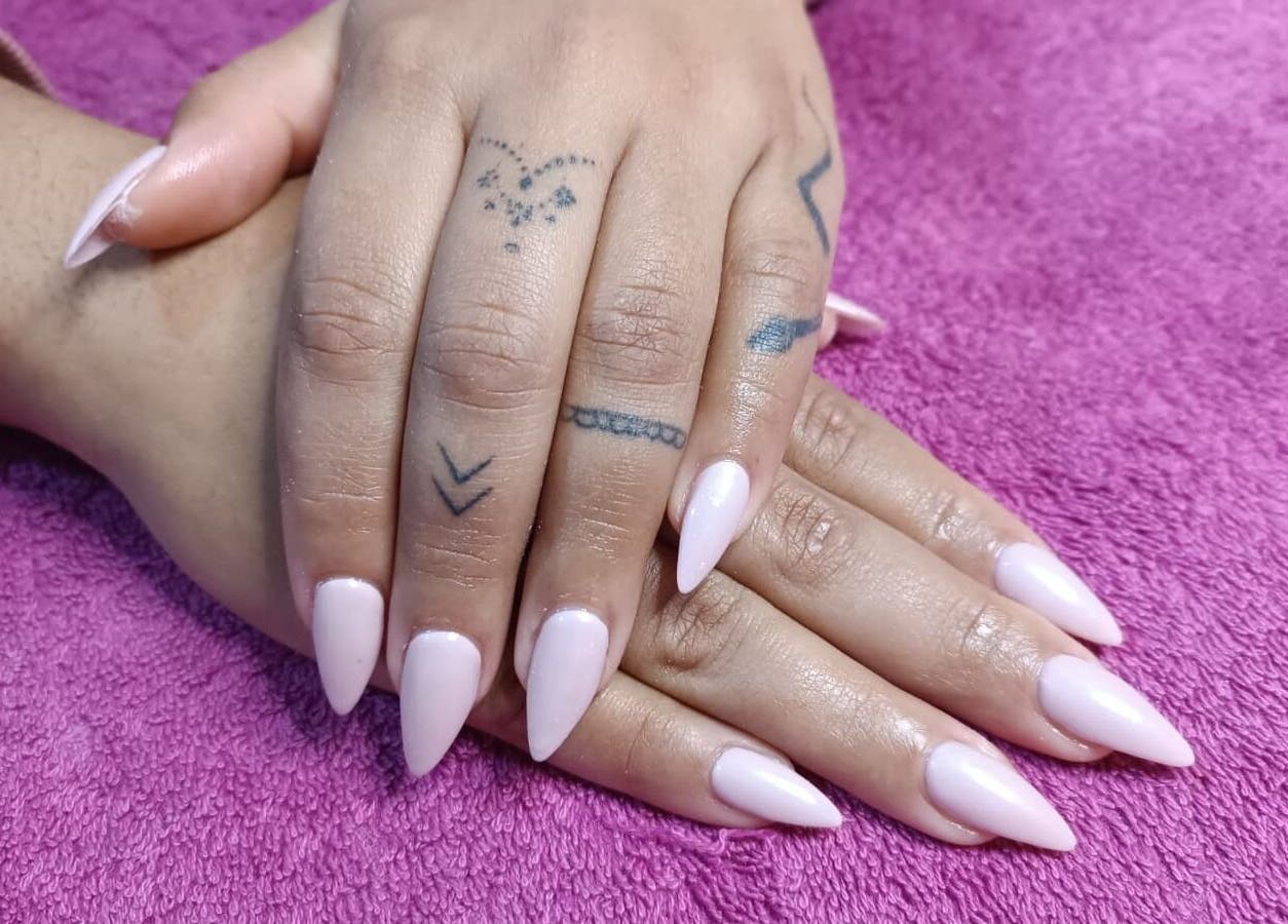 Beautiful manicured hands with soft pink nails at Skin and Bling Brackenfell, Cape Town, Western Cape, ZA.