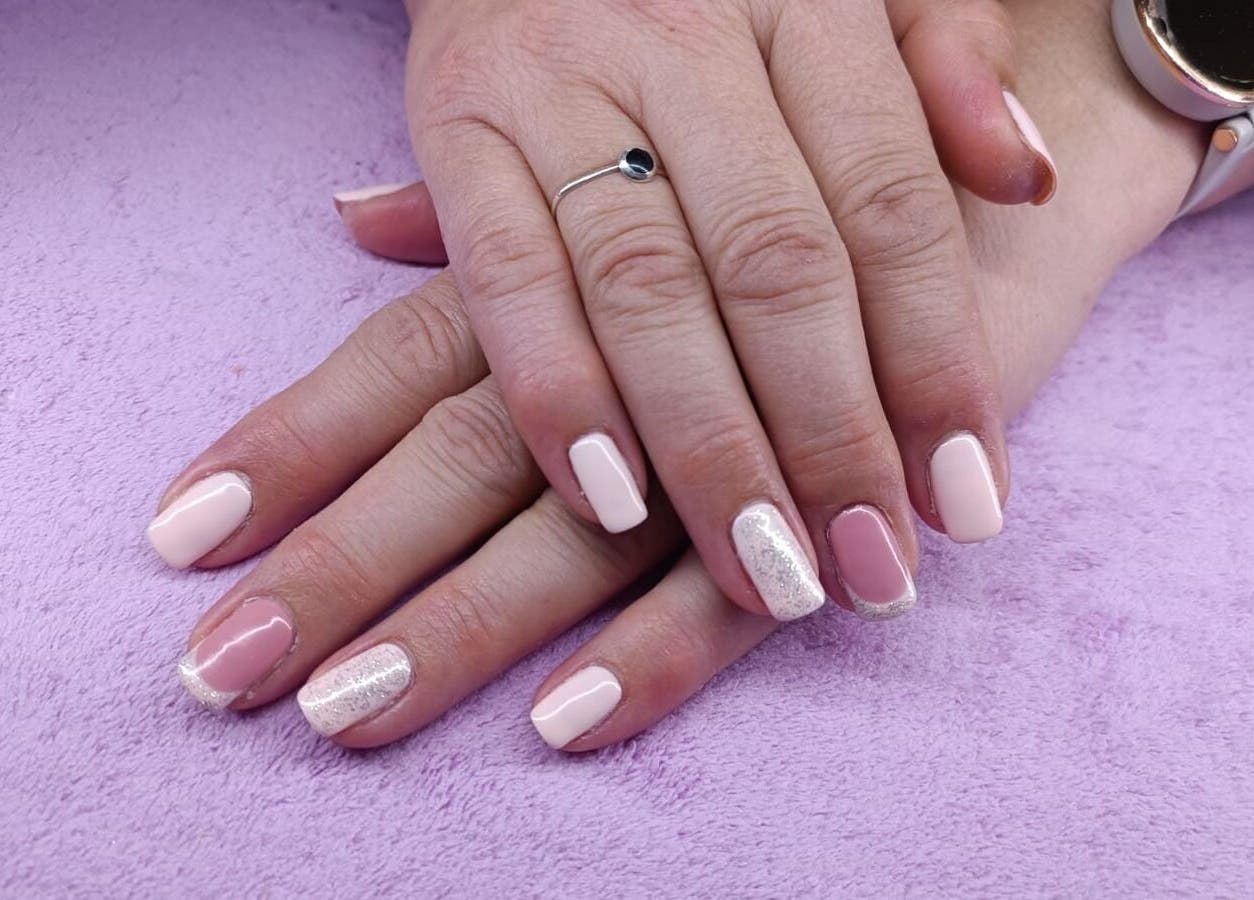 Elegant gel manicure at Skin and Bling Brackenfell, Cape Town, Western Cape, ZA. Features pink and glitter nails.