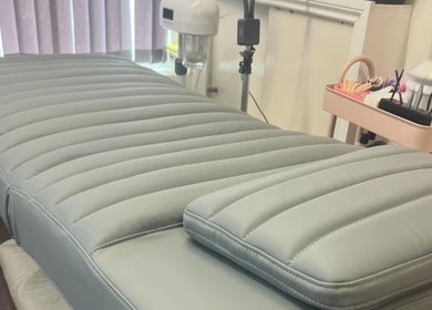 Comfortable treatment bed at Lowes Lashes Aesthetics Sunbed, Faversham, England, GB.