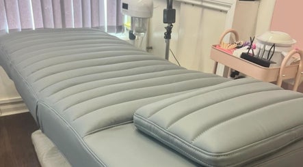 Comfortable treatment bed at Lowes Lashes Aesthetics Sunbed, Faversham, England, GB.