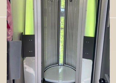 Vertical sunbed at Lowes Lashes Aesthetics Sunbed, Faversham, England, GB, featuring sleek design.