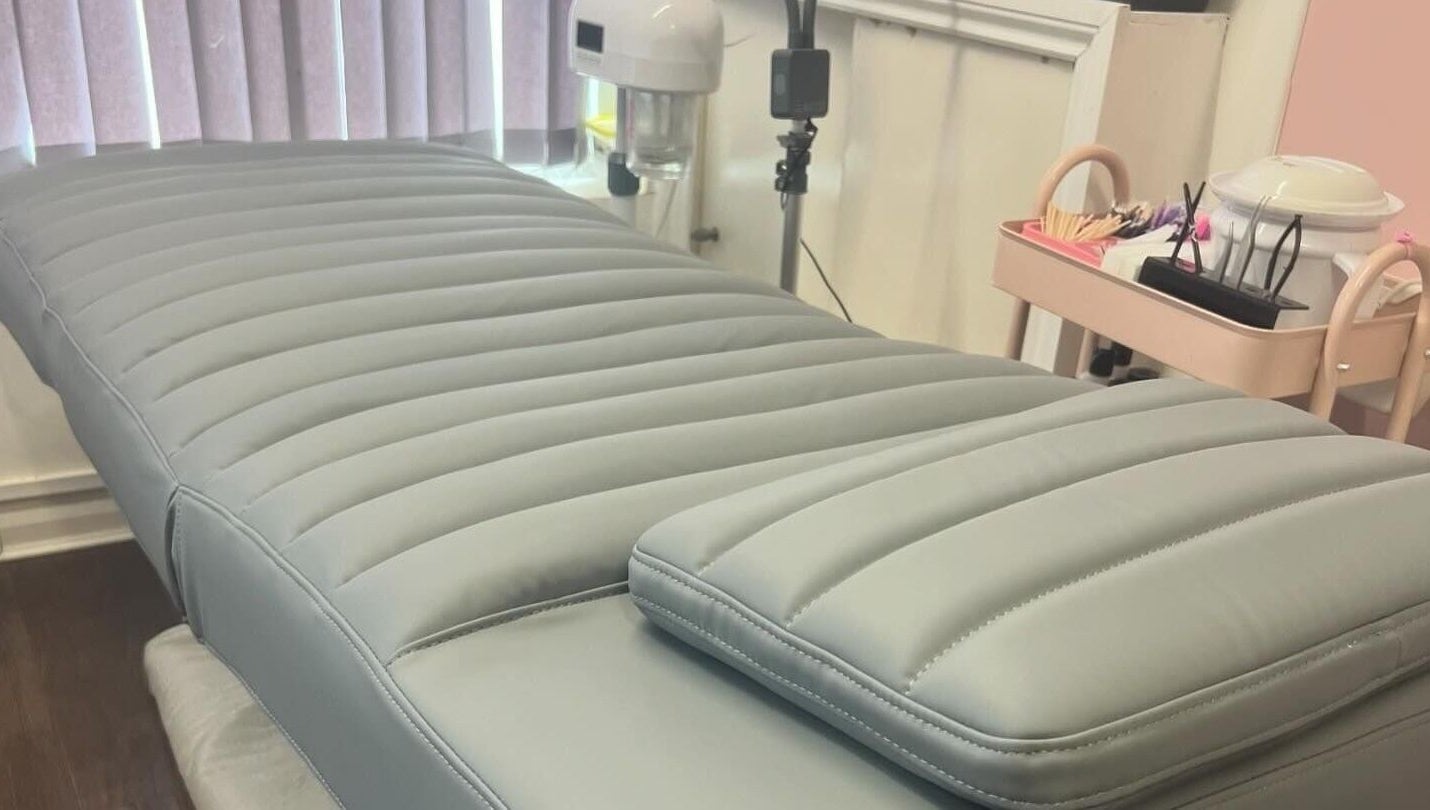 Treatment bed at Lowes Lashes Aesthetics Sunbed, Faversham, England, GB. Modern, comfortable setting for beauty services.