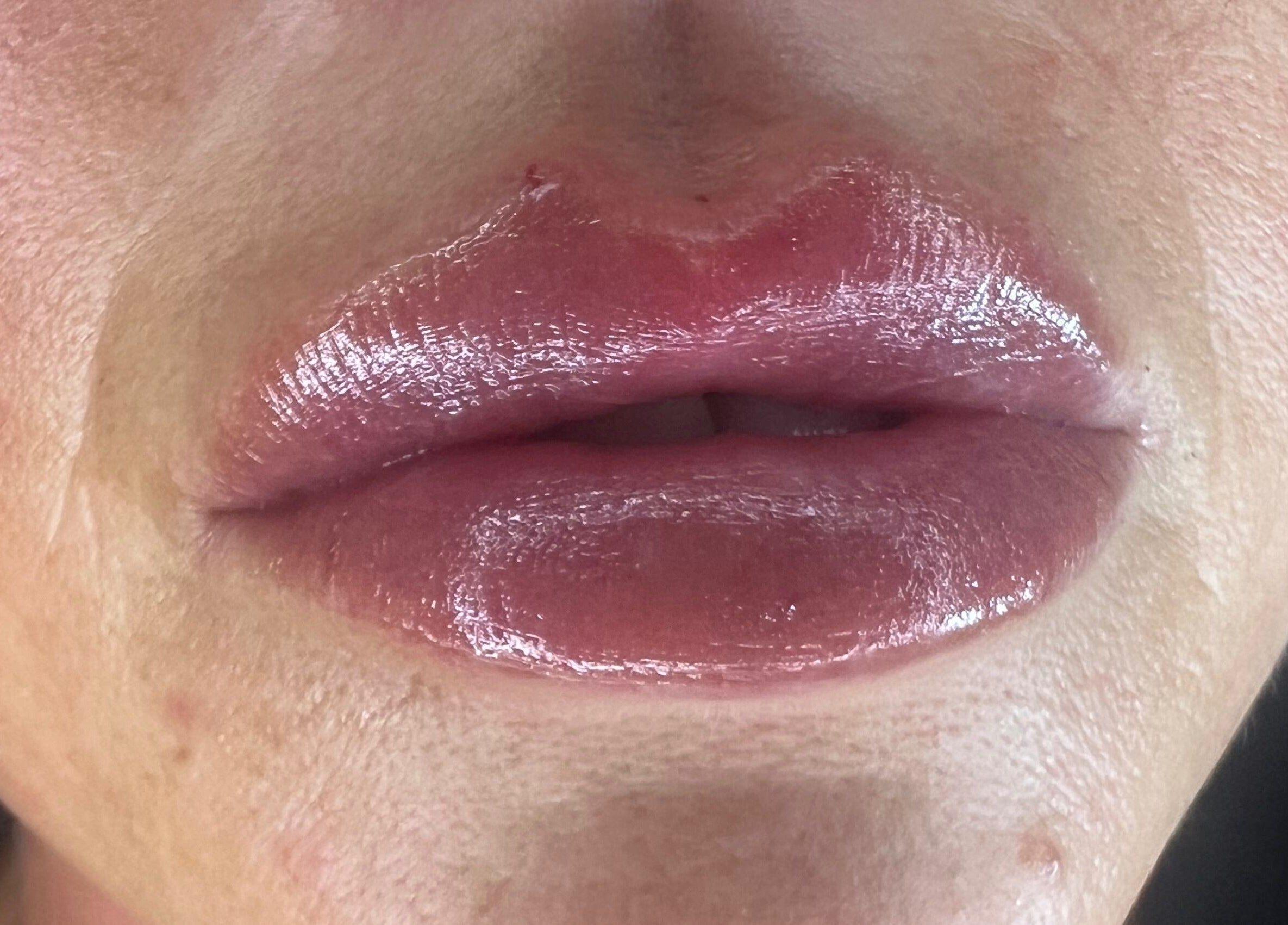 Close-up of glossy lips at Lowes Lashes Aesthetics Sunbed, Faversham, England, GB.