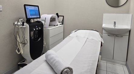 Treatment room at Orchid Beauty & Massage - Kensington, London, England, GB, featuring modern spa equipment.