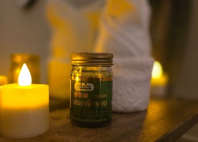 Relaxing candlelit setting at Orchid Beauty & Massage - Kensington, London, England, GB with massage oil.