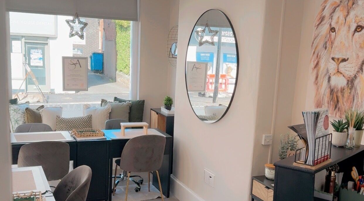 Chic interior of Tantalize beauty studio in Telford, England, GB with plush seating and elegant decor.