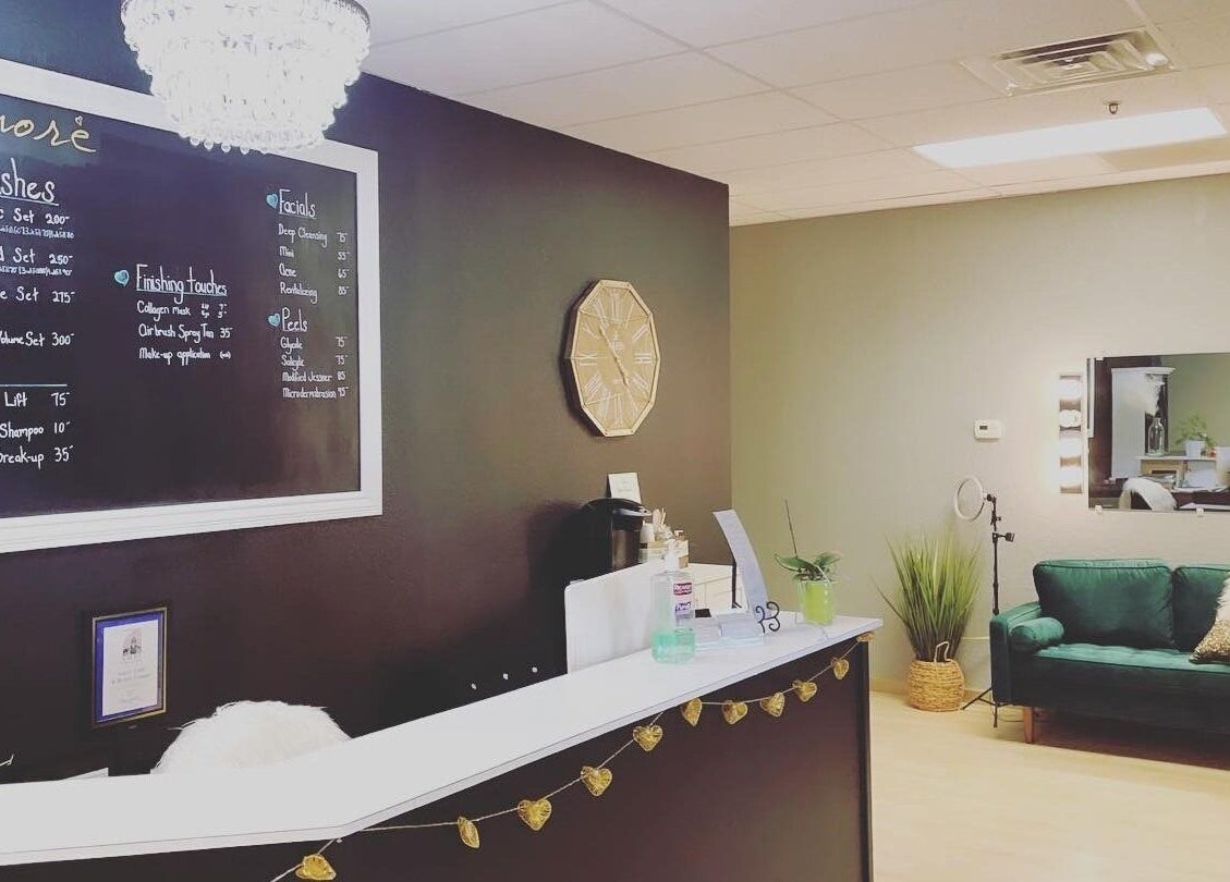 Reception area at Amore Lash Lounge in Auburn, California, US showcasing a cozy ambiance and elegant decor.