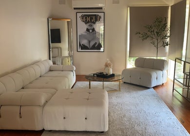 Sophisticated sitting area at Luxe Contouring By Sofia, Melbourne, Victoria, AU, featuring plush seating.