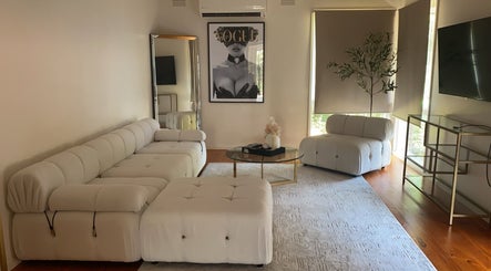 Sophisticated sitting area at Luxe Contouring By Sofia, Melbourne, Victoria, AU, featuring plush seating.