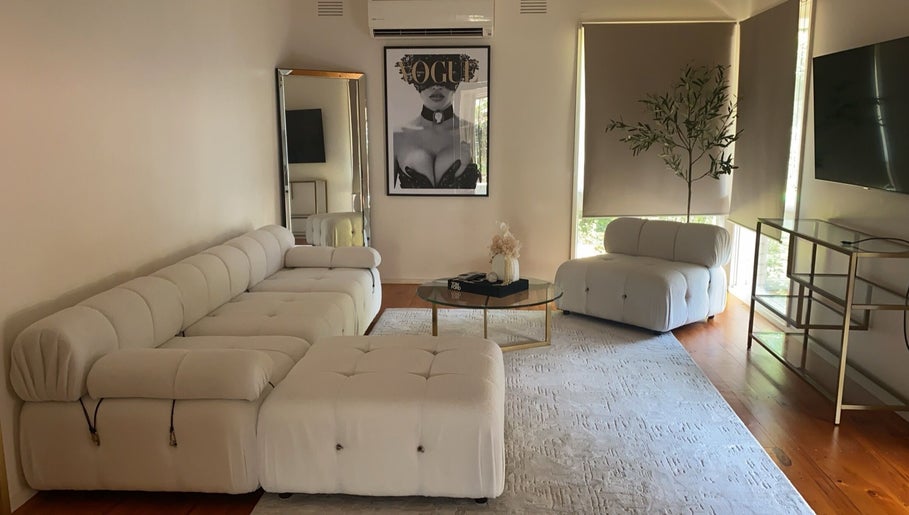 Sleek lounge area at Luxe Contouring By Sofia, Melbourne, Victoria, AU with modern decor and elegant seating.