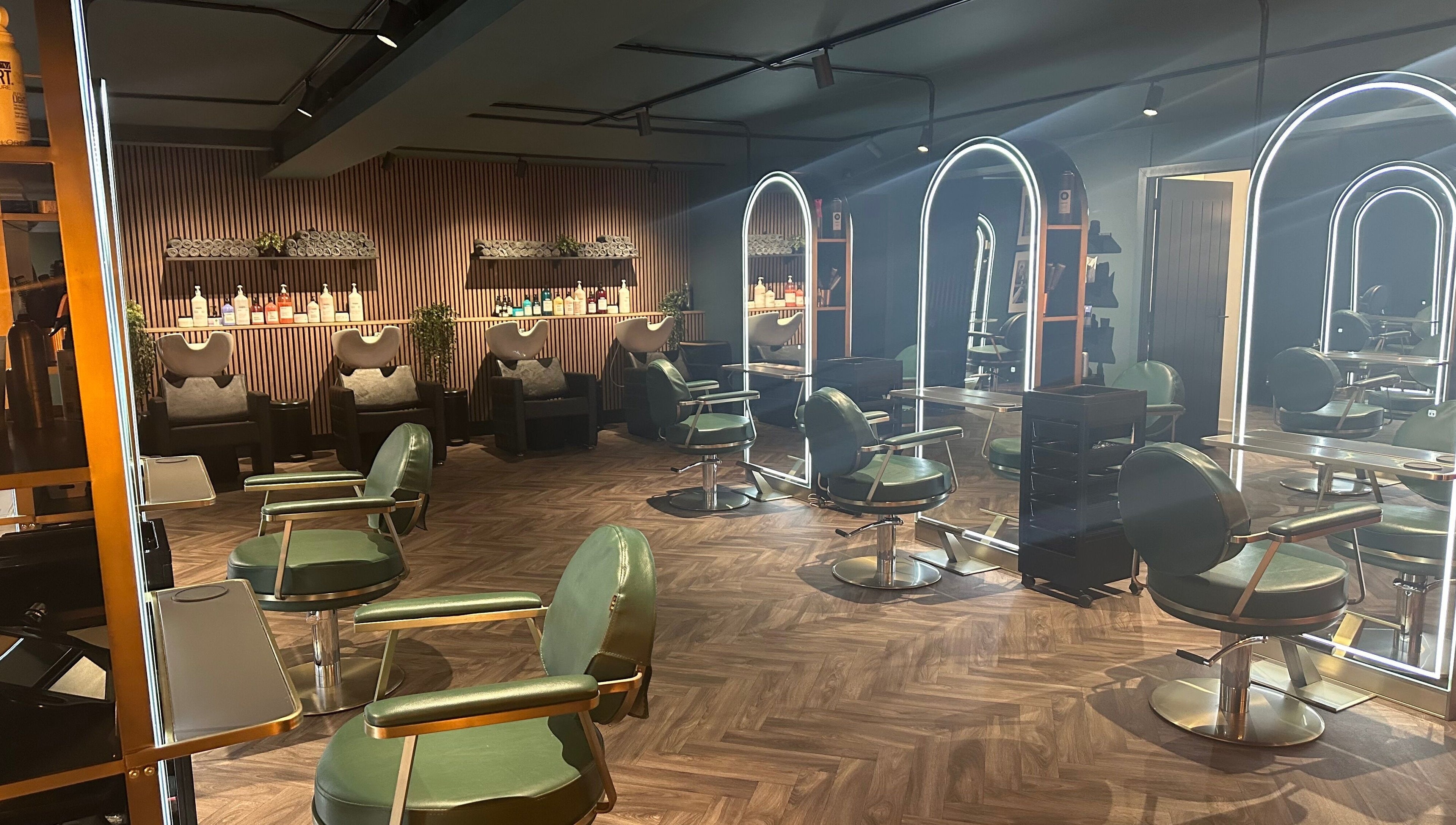 Chic interior of Chandler and Co. salon in Bedale, England, GB featuring stylish chairs and mirrors.