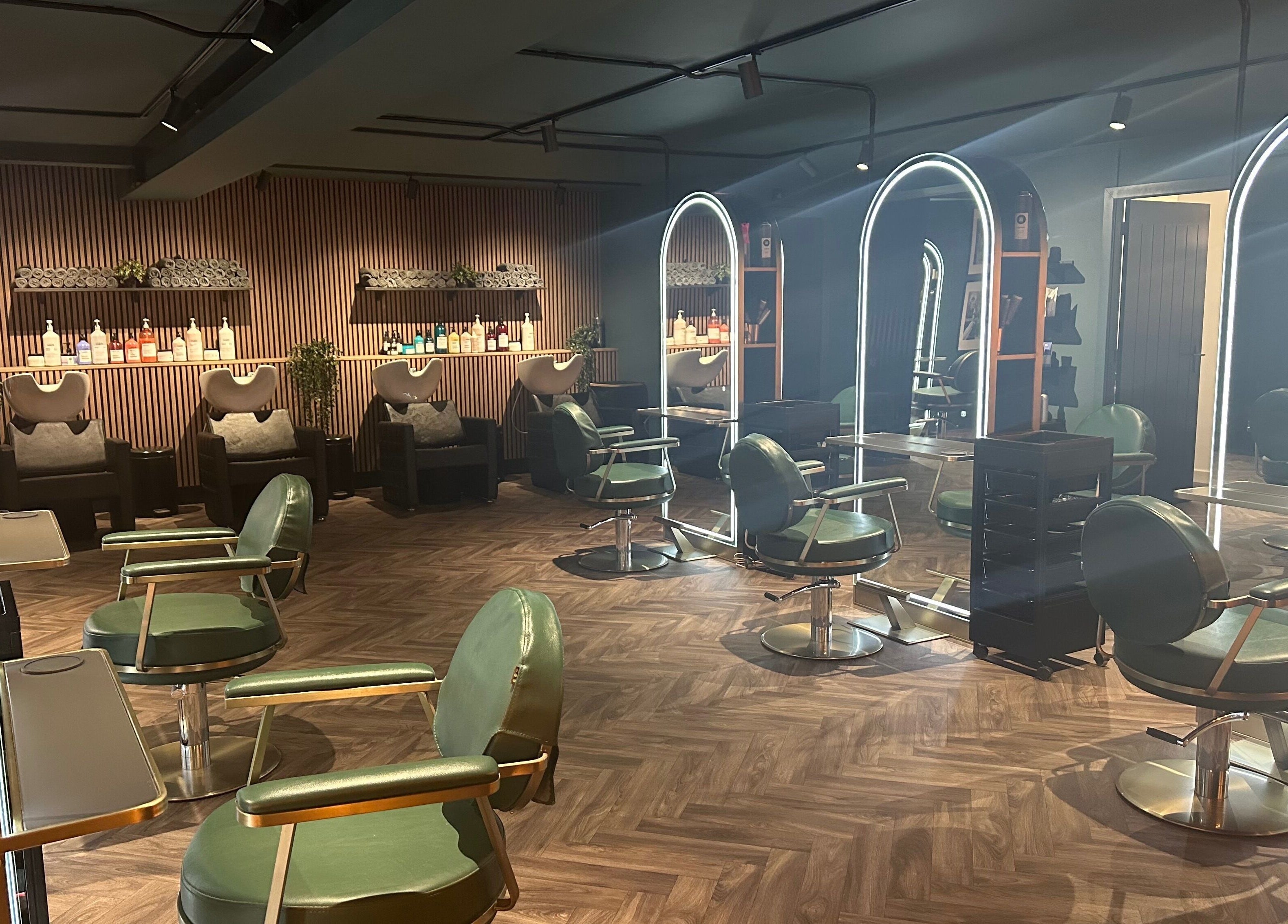 Chic interior of Chandler and Co. salon in Bedale, England, GB featuring stylish chairs and mirrors.