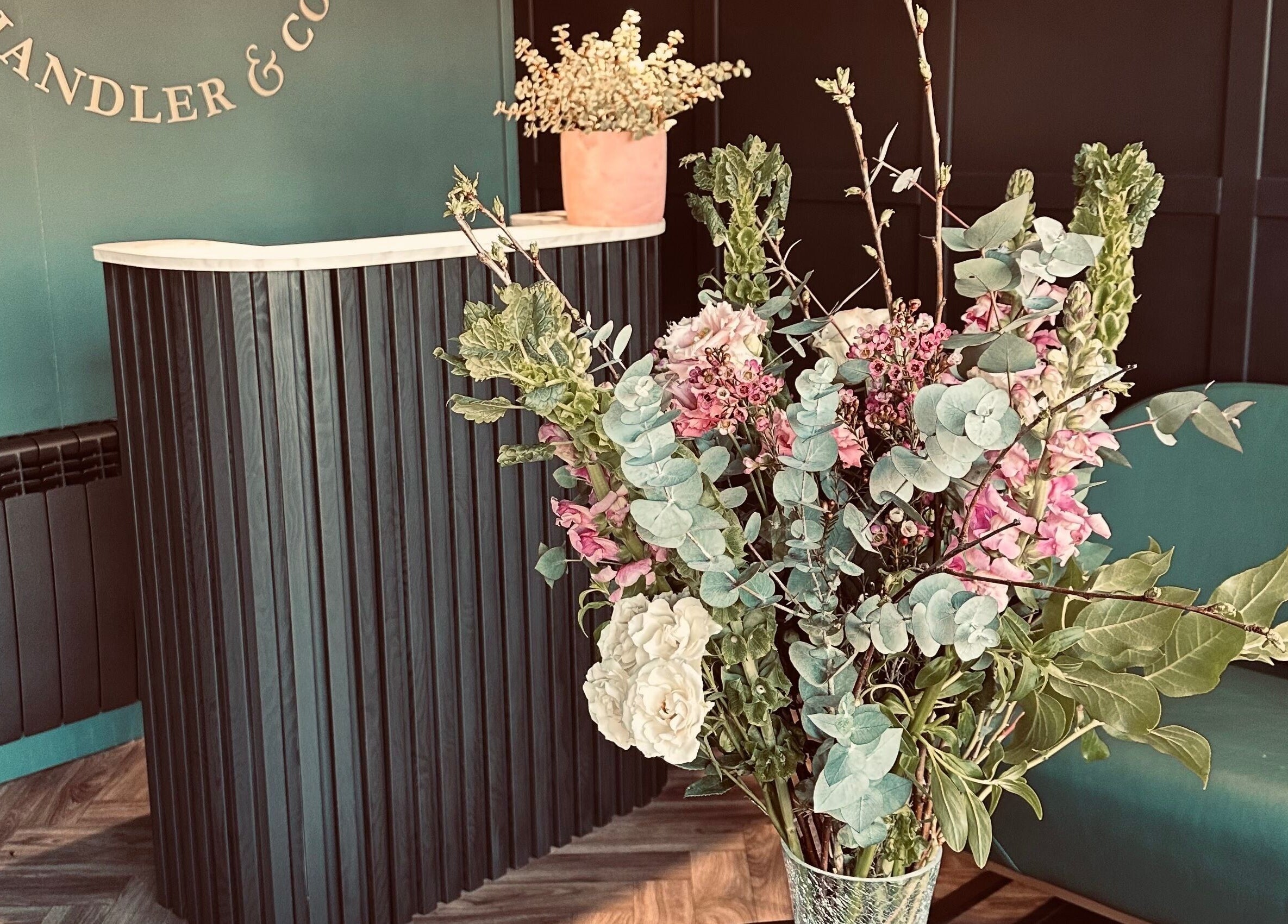 Chandler and Co. reception with elegant floral decor in Bedale, England, GB. Modern and inviting atmosphere.