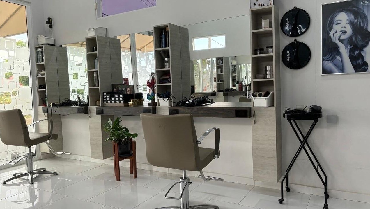 Modern salon interior at Mel An Gi Hair NV, Paramaribo, Paramaribo, SR with stylish chairs and sleek mirrors.