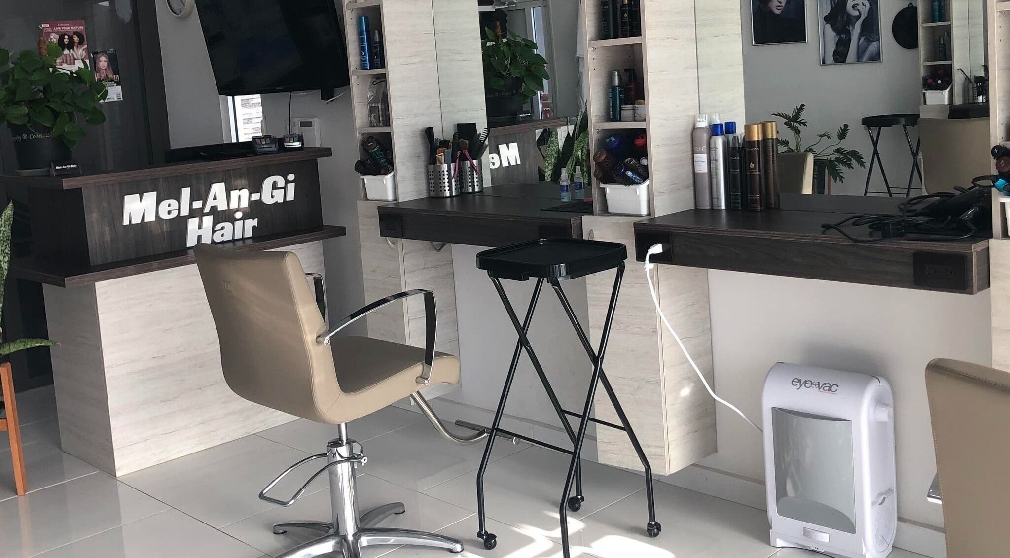 Chic salon workstation at Mel An Gi Hair NV in Paramaribo, Paramaribo, SR, featuring modern decor and beauty products.