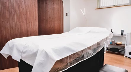 Relaxing massage table at HRM Beauty, Rayleigh, England, GB, ready for a calming spa session.