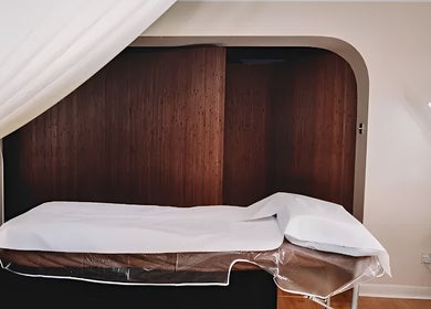 Massage room at HRM Beauty, Rayleigh, England, GB featuring a comfortable treatment bed and calming ambiance.