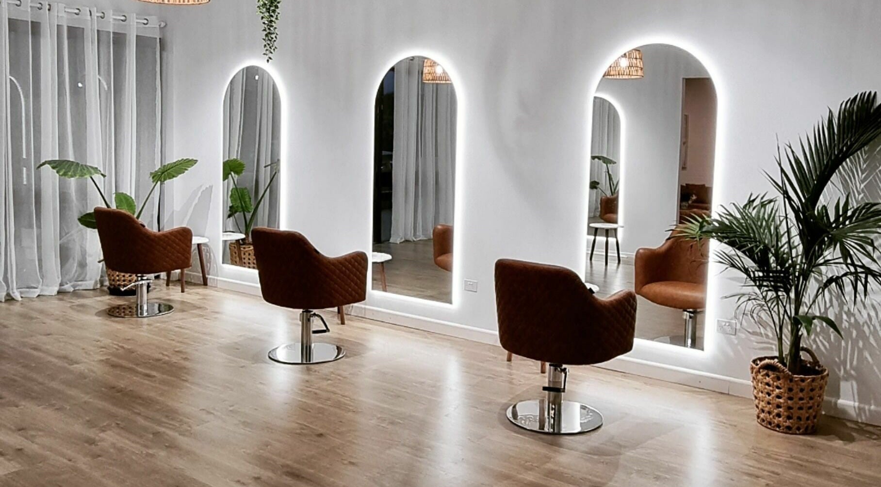 Chic salon interior with modern mirrors at Coco Blonde Hair, Southport, Queensland, AU.