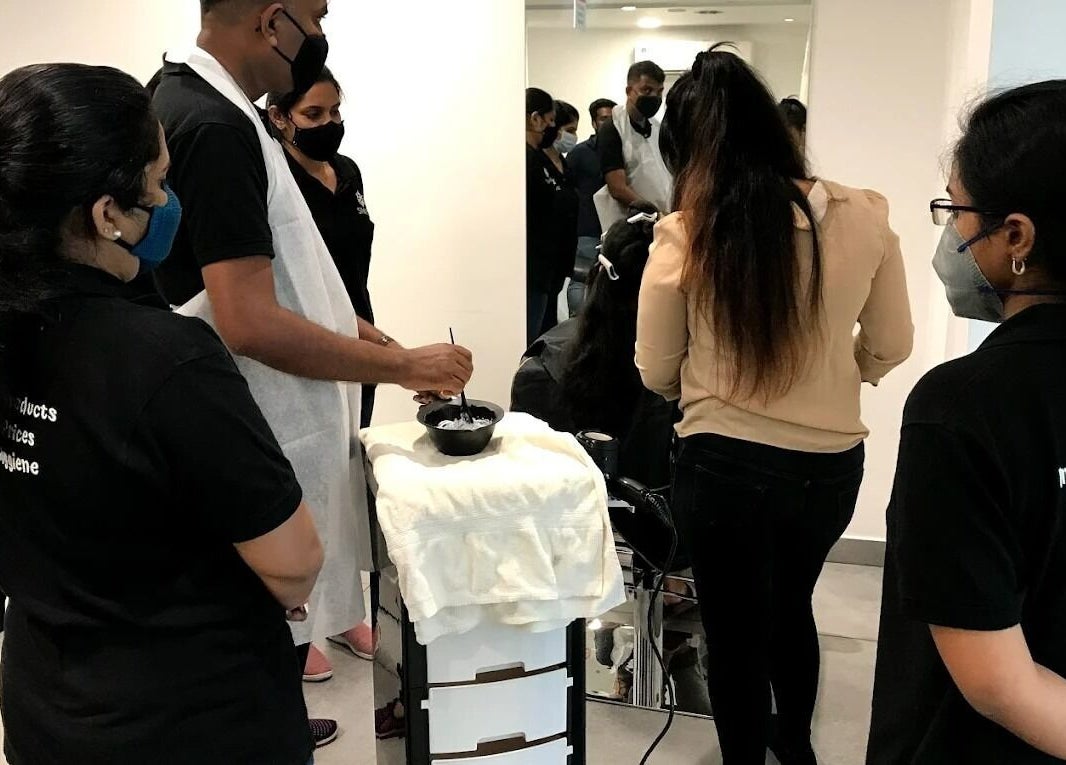 Stylists training at SINIMA Salon - Edappally, Kochi, Kerala, IN enhancing skills in a modern setting.