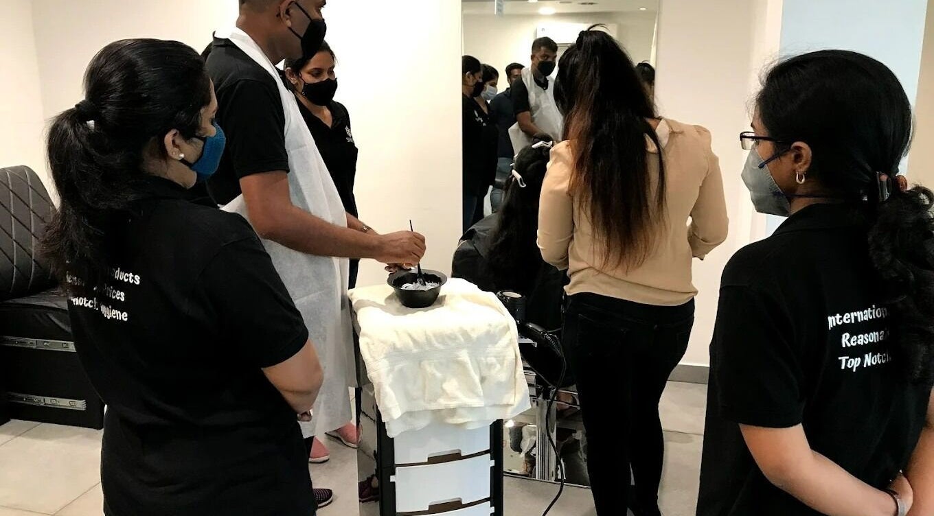 Stylists training at SINIMA Salon - Edappally, Kochi, Kerala, IN enhancing skills in a modern setting.