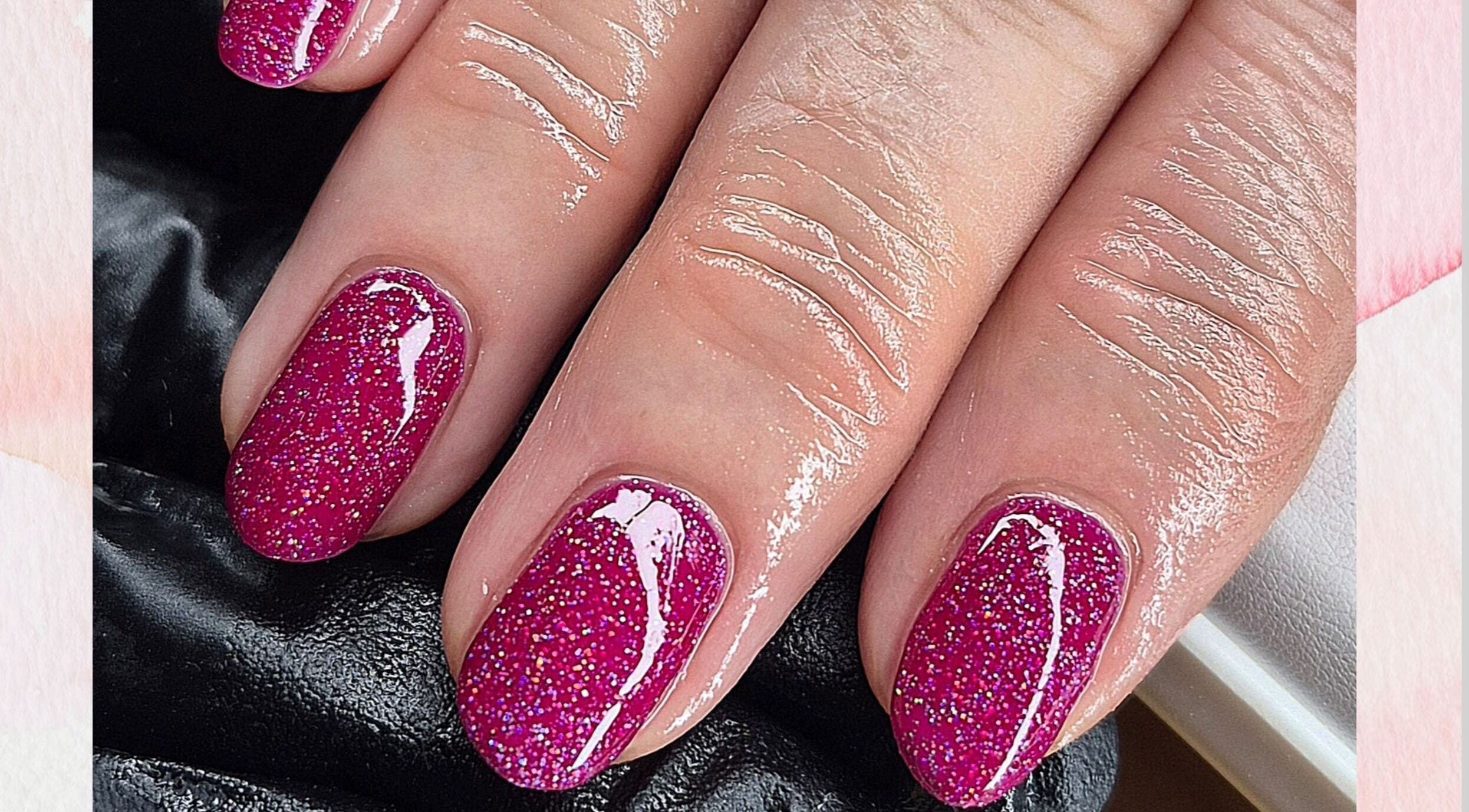 Sparkling pink glitter nails at Fi Fi's Beauty in Fareham, England, GB, showcasing expert nail artistry.