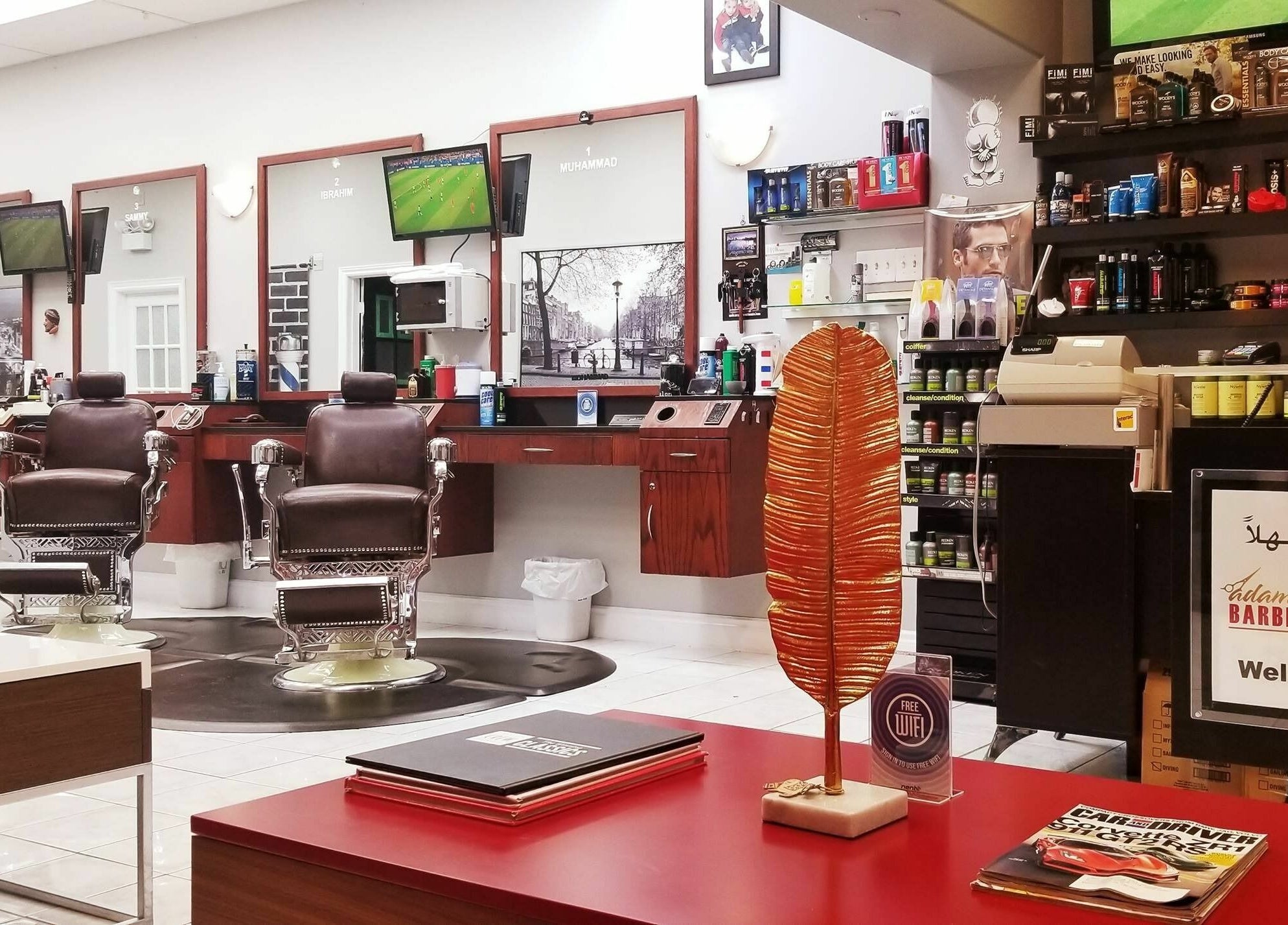 Modern interior of Adam's Barber Chair in Mississauga, Ontario, CA with classic barber chairs and grooming products.