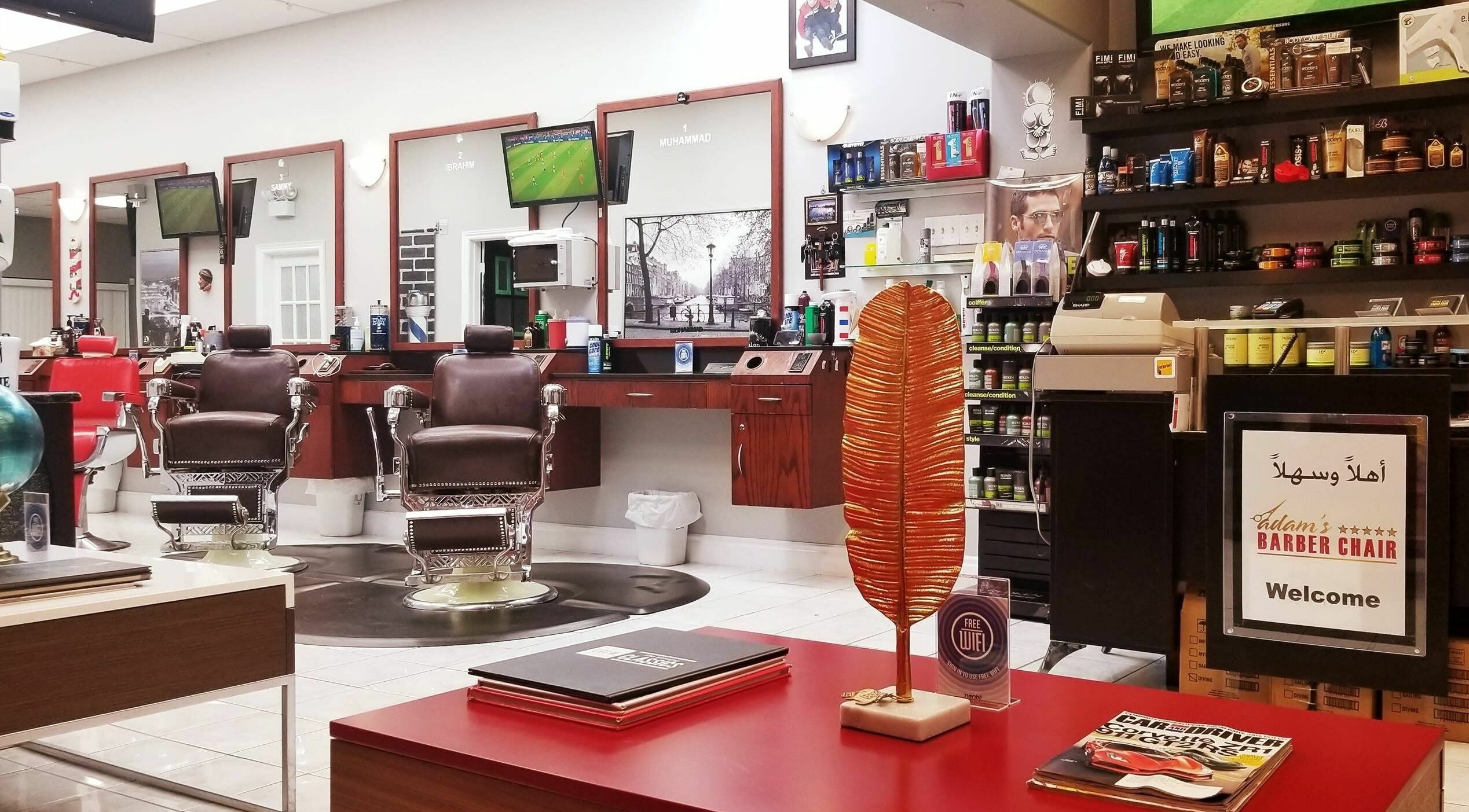 Modern interior of Adam's Barber Chair in Mississauga, Ontario, CA with classic barber chairs and grooming products.