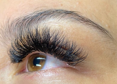 Detailed close-up of expertly applied eyelash extensions at Glamour Queen Artistry Inc., Coquitlam, British Columbia, CA.