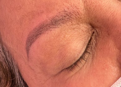 Close-up of expertly shaped eyebrows at LashedByCarina in Toronto, Ontario, CA.