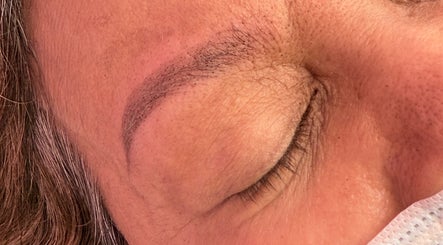 Close-up of expertly shaped eyebrows at LashedByCarina in Toronto, Ontario, CA.