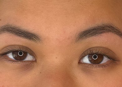 Well-groomed eyebrows showcasing beauty service by LashedByCarina in Toronto, Ontario, CA.