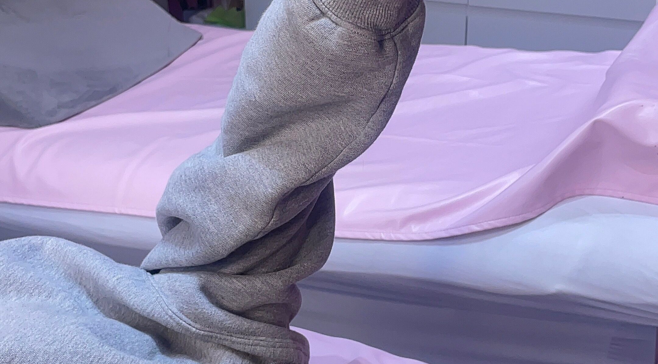 Cozy treatment bed with pink sheets at LashedByCarina, Toronto, Ontario, CA.