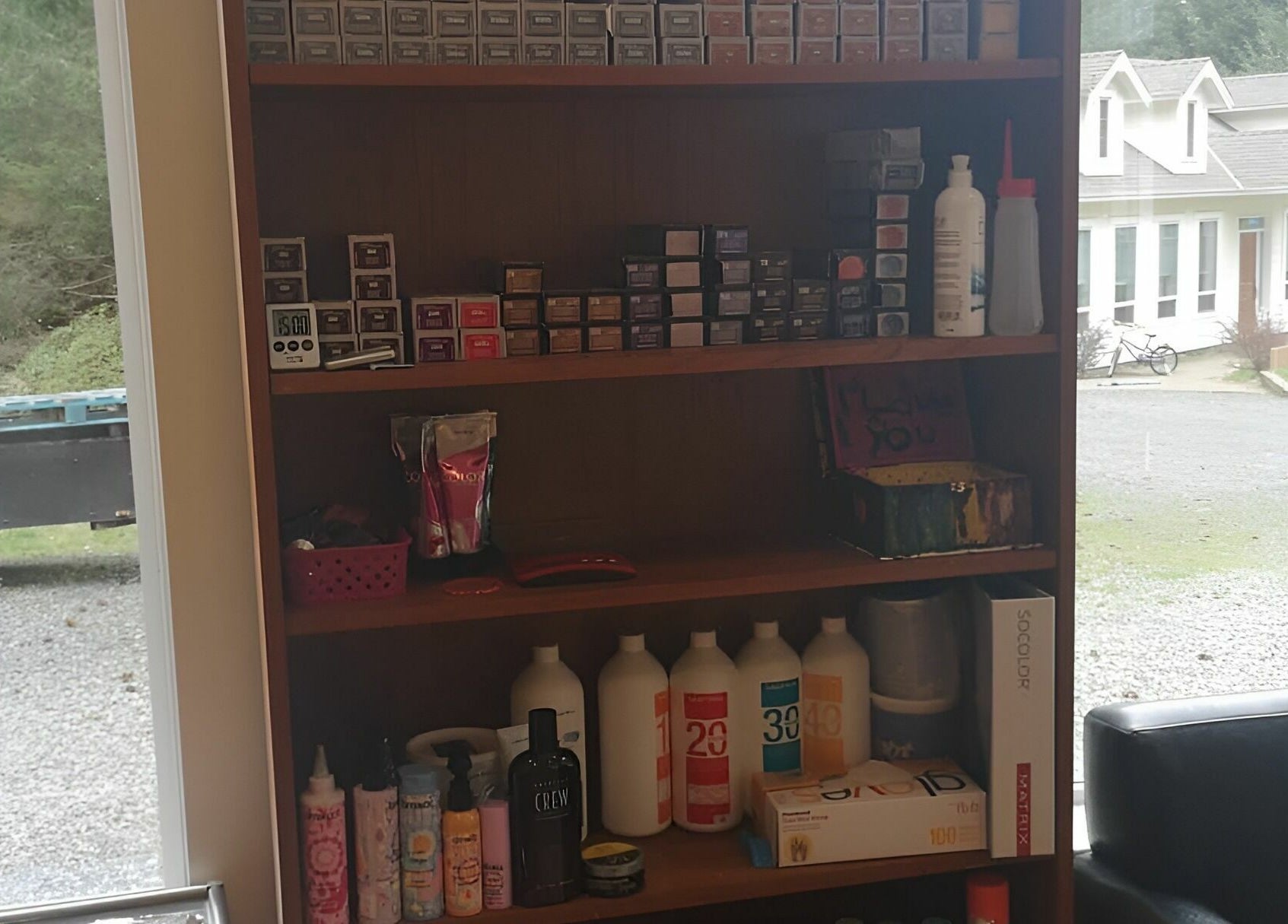 Hair products on shelves at Kat's Hair Studio, Sooke, British Columbia, CA. A peek into premium salon supplies.