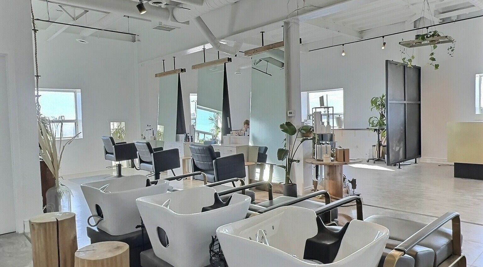 Modern interior of Love's In The Hair Extension Studio Inc. in Toronto, Ontario, CA, showcasing stylish salon chairs.