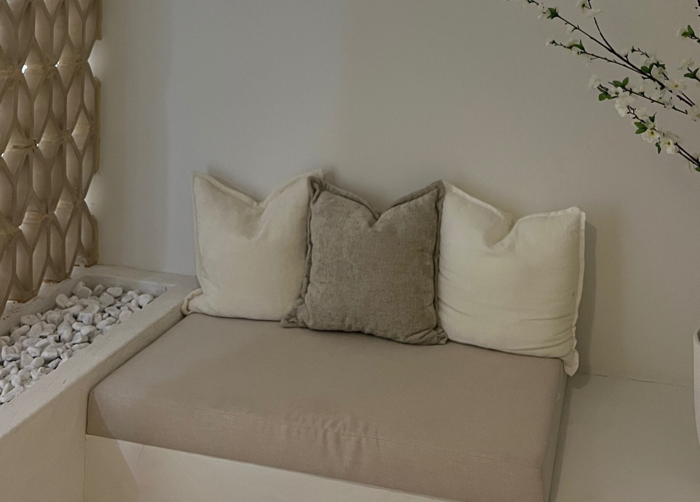 Cozy seating area at Inkd Aesthetics, Surfers Paradise, Queensland, AU, featuring a minimalist design.