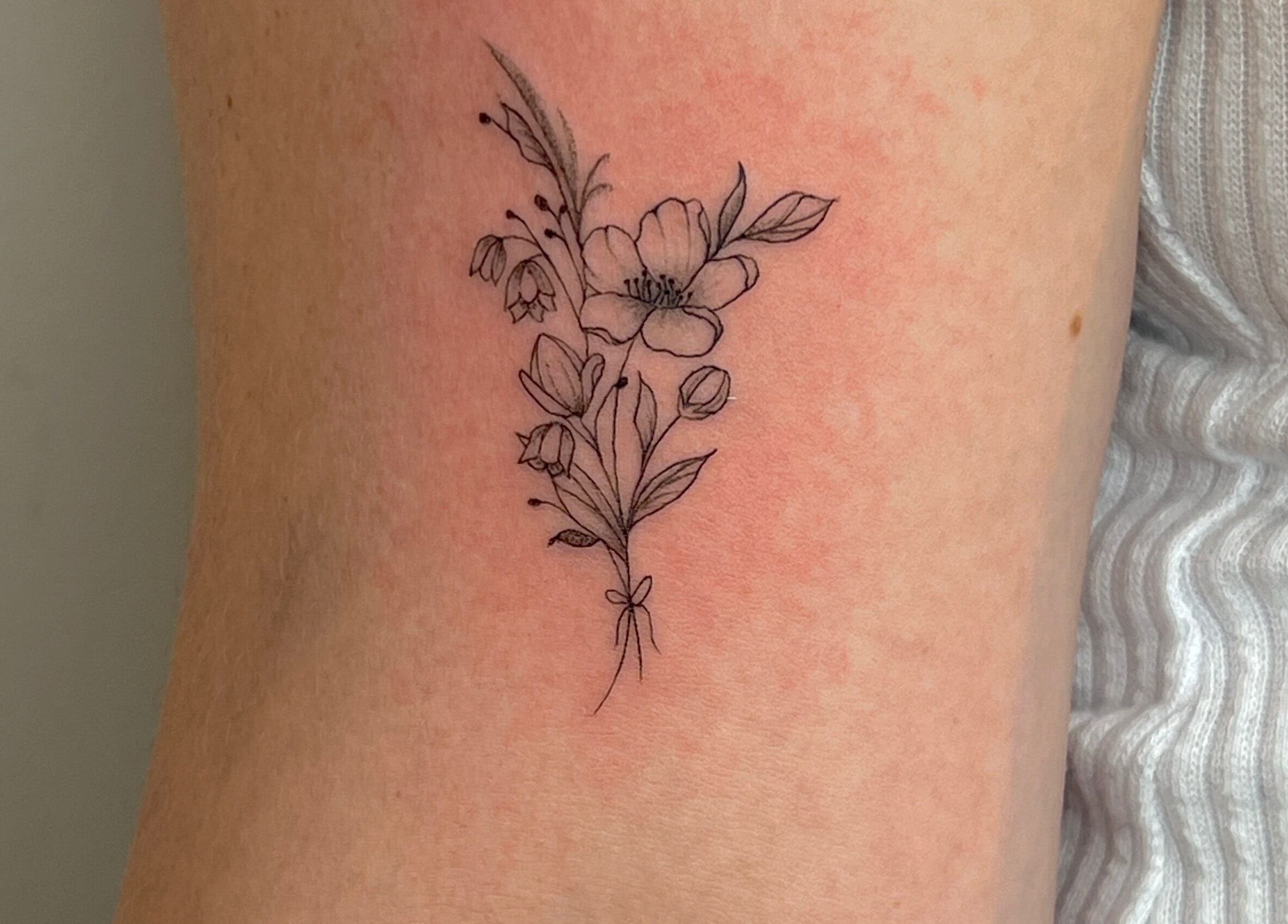 Elegant floral tattoo design at Inkd Aesthetics, Surfers Paradise, Queensland, AU, showcasing artistic ink work.