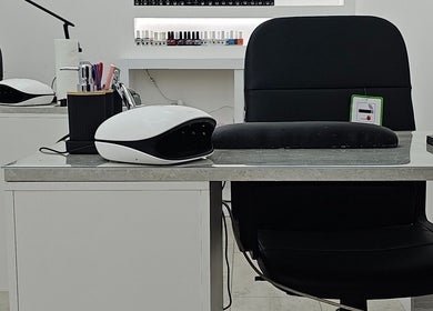 Modern nail station at Nude Skin Clinic (Naomi), Manchester, England, GB, showcasing professional manicure setup.