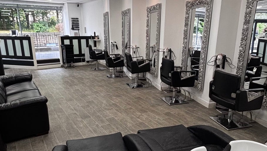 Sleek styling chairs at Gemma Louise Hair and Beauty, Rawtenstall, England, GB with ornate mirrors in view.