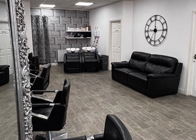 Interior of Gemma Louise Hair and Beauty, Rawtenstall, England, GB, showcasing modern salon chairs and elegant decor.