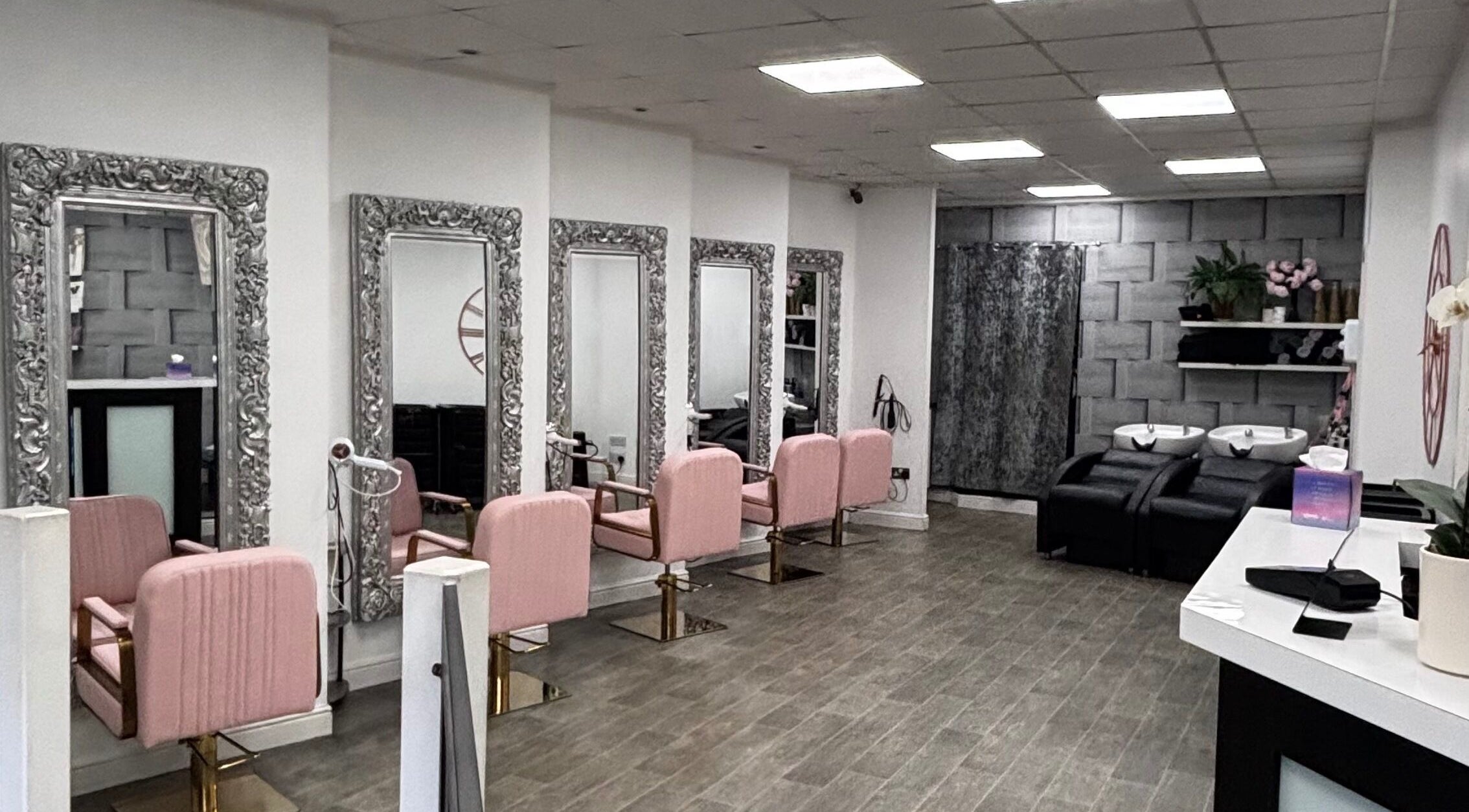 Gemma Louise Hair and Beauty salon interior in Rawtenstall, England, GB with pink chairs and ornate mirrors.
