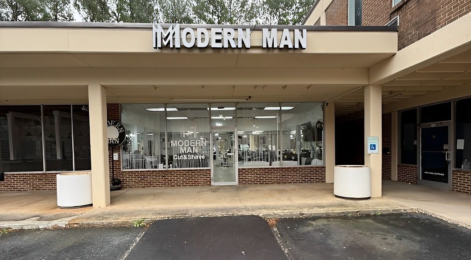 Modern Man South End, a stylish beauty venue located in Charlotte, North Carolina, US, with sleek storefront design.