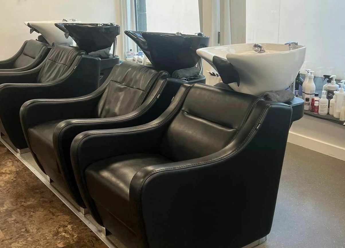 Luxurious wash chairs at Macie's in Guernsey, Castel, GG for premium hair care experience.